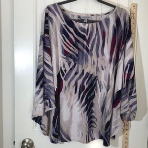 3/4 Dolman Sleeved, crew neck, swing blouse. Heavier weight poly knit